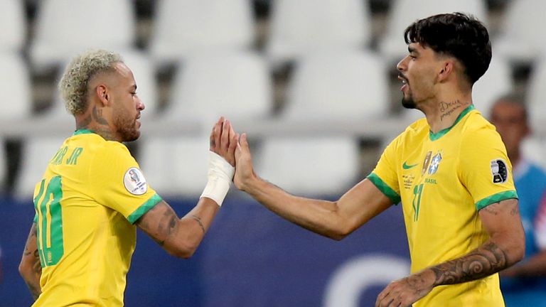 Neymar and Lucas Paqueta celebrate after combining for Brazil's only goal in their 1-0 win over Chile