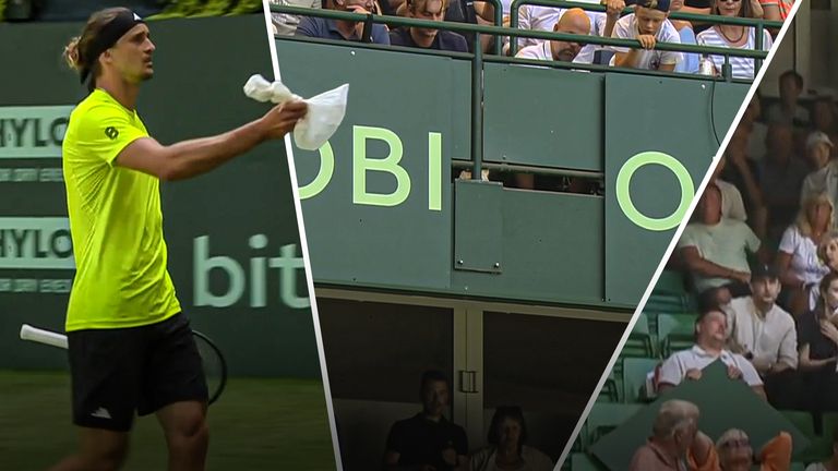 Tennis player Alexander Zverev offers a bag of ice to the crowd after an advertising board fell from the Halle stadium onto spectators